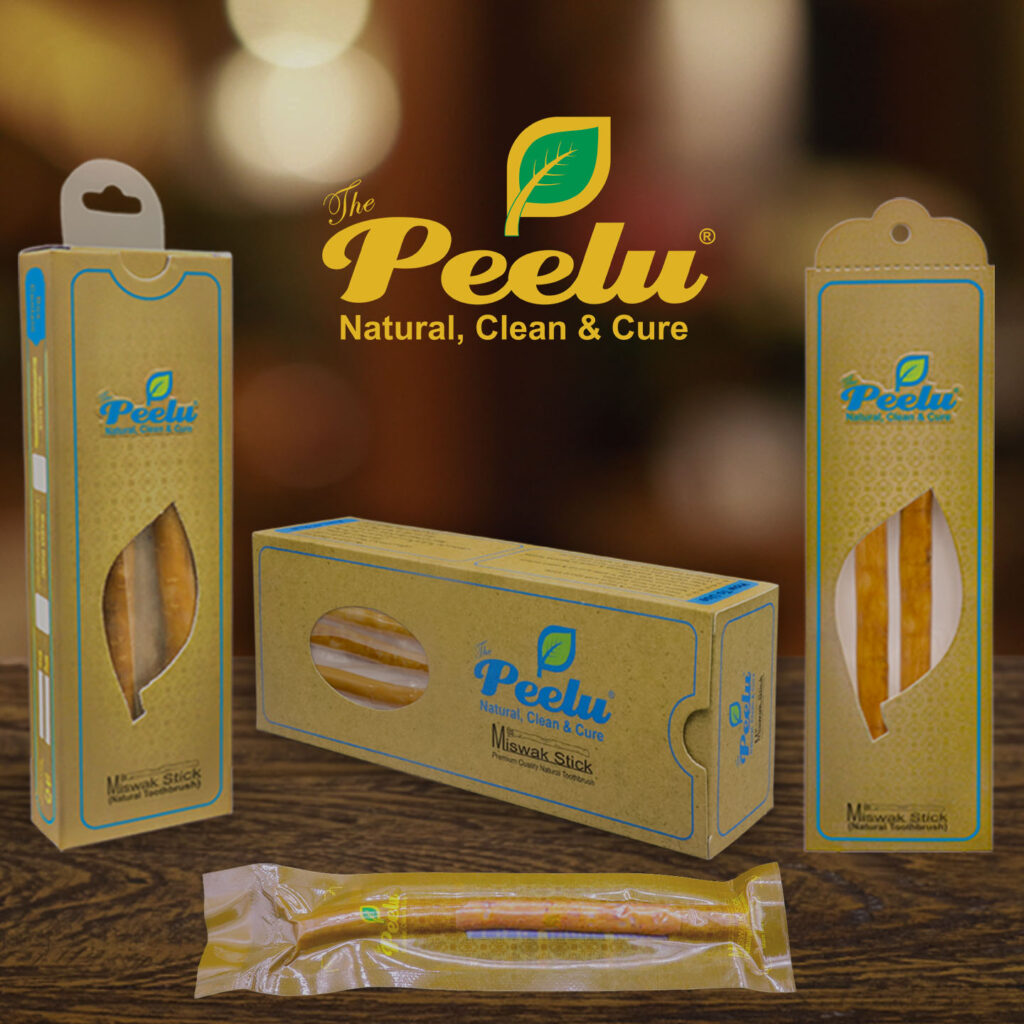 Peelu Miswak on table with multiple packing