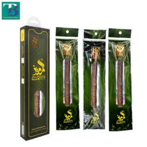 Three thick olive wood miswak sticks laid out on a white background, showcasing natural texture and fresh fiber ends.